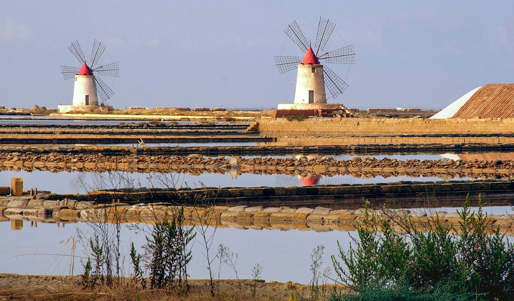 The salty water ponds with two windmills are located in Marsala