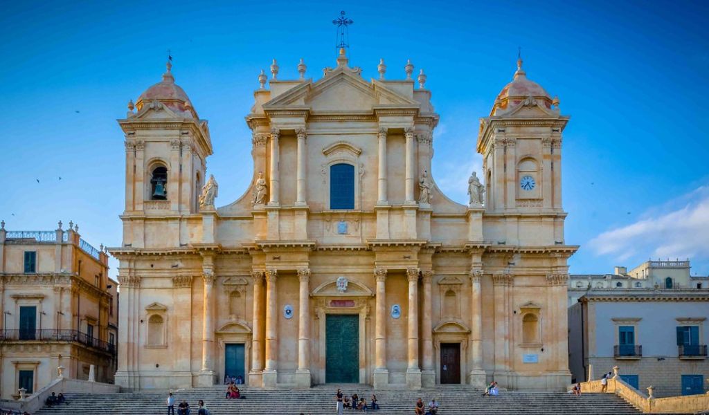 Tourists visit the Noto Cathedral, Sicily