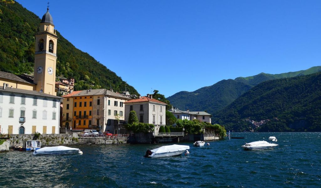 Scenic View of Lake Como with luxury tour boat in Italy