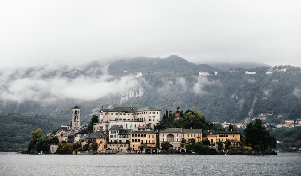 An island on Lake Maggiore with a background of a foggy mountain