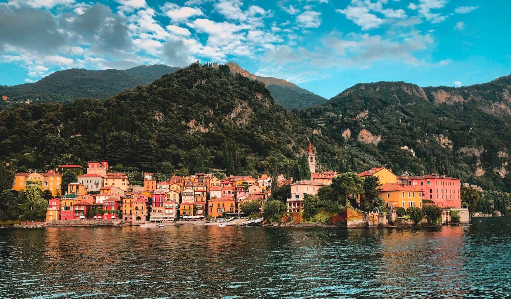 A beautiful Lake Como with colorful houses and green rocky mountains