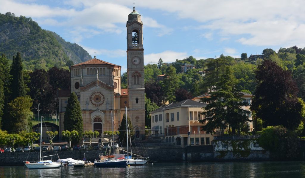 Boats parked in front of the Church in Lake Como