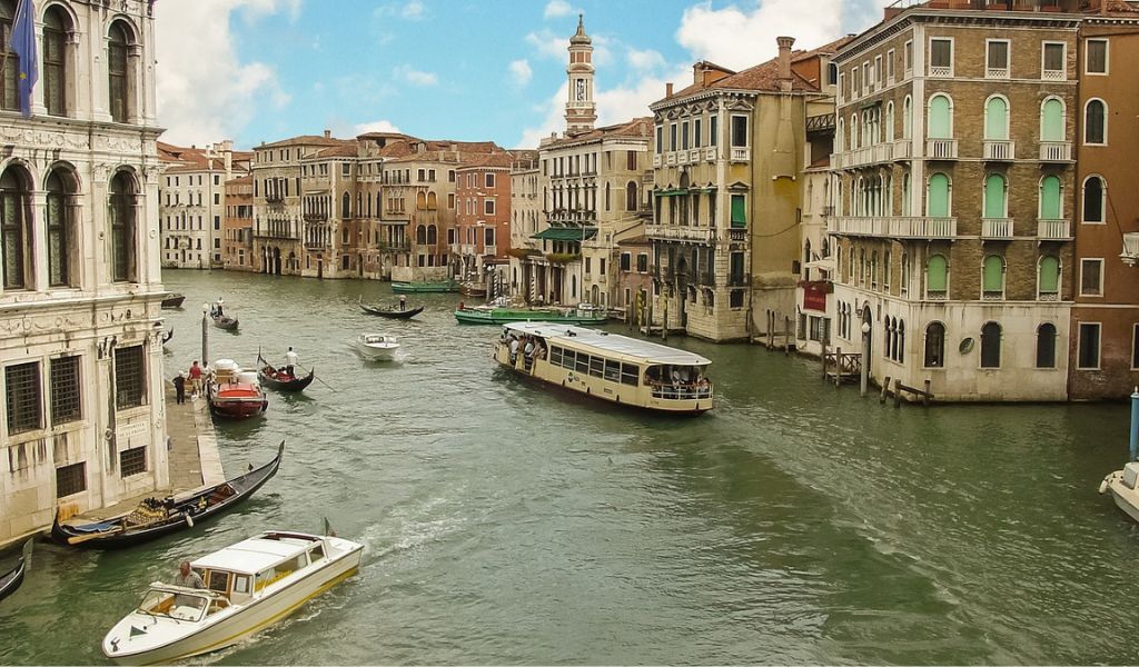 Tourists visit the Venetian Lagoon through the Gondola.