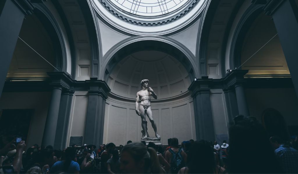Tourist visit the Michelangelo's David statue in Florence, Italy