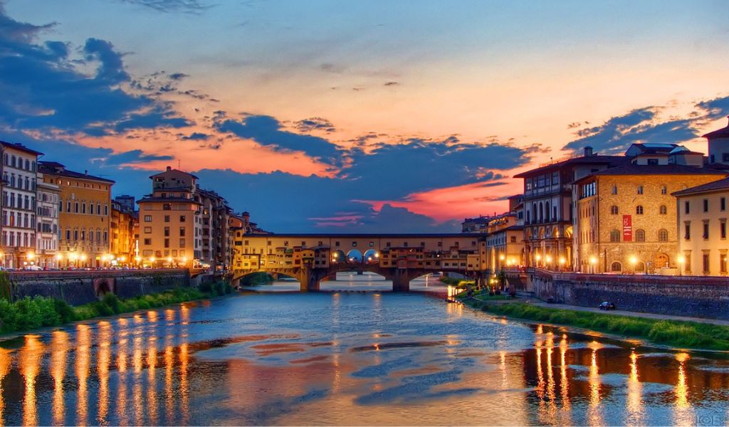 Night view of the Old Bridge Across Arno River in Florence, Italy