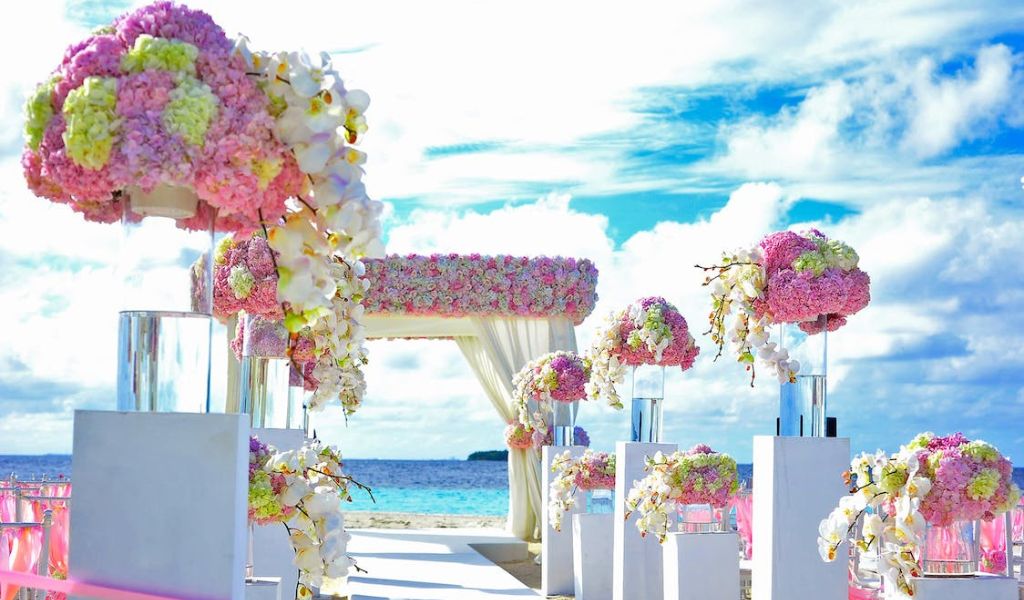 Pink, Yellow, and Purple Flowers Decor on Wedding Venue in Villa Three Villas