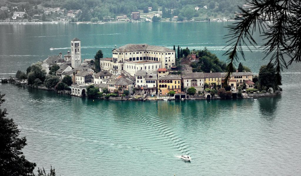 A small village on a lake with private boat tours and luxury hotels in Lake Orta.