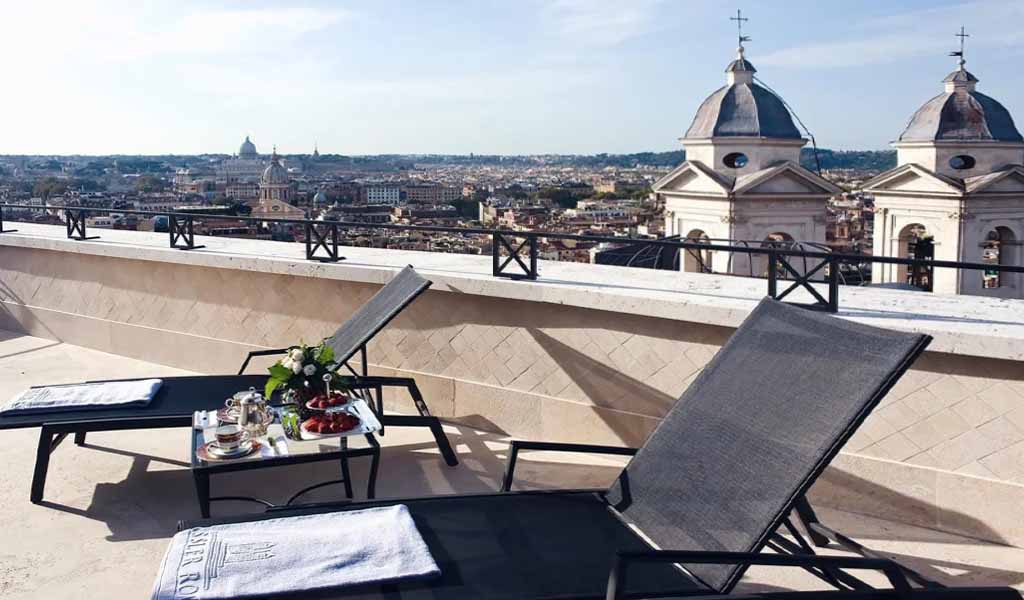 A top view of beautiful churches and buildings from the rooftop of the Hotel Hassler, Rome.