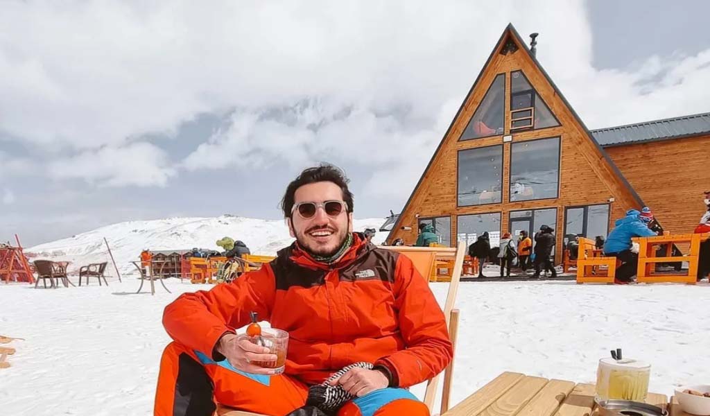Barkin Ozdemir enjoy drinking juice after skiing.
