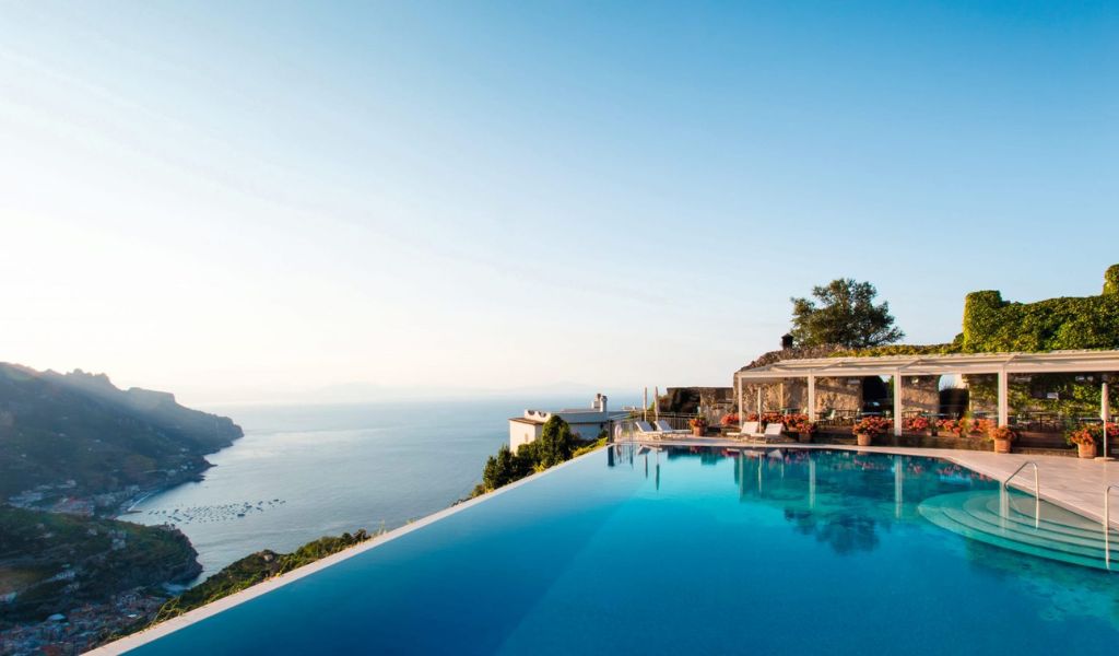 The Belmond Hotel Caruso has a luxury pool with a breathtaking view of the town and sea of the Amalfi coast.