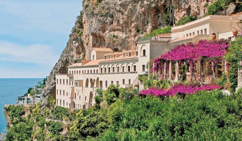 The Grand Hotel Convento di Amalfi on a cliff with a view of the sea and sky is located on the Amalfi coast.