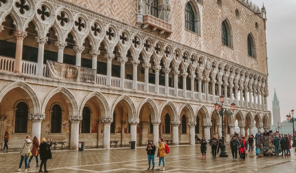 Tourists visit one of the landmarks in Venice, the Doge's Palace.