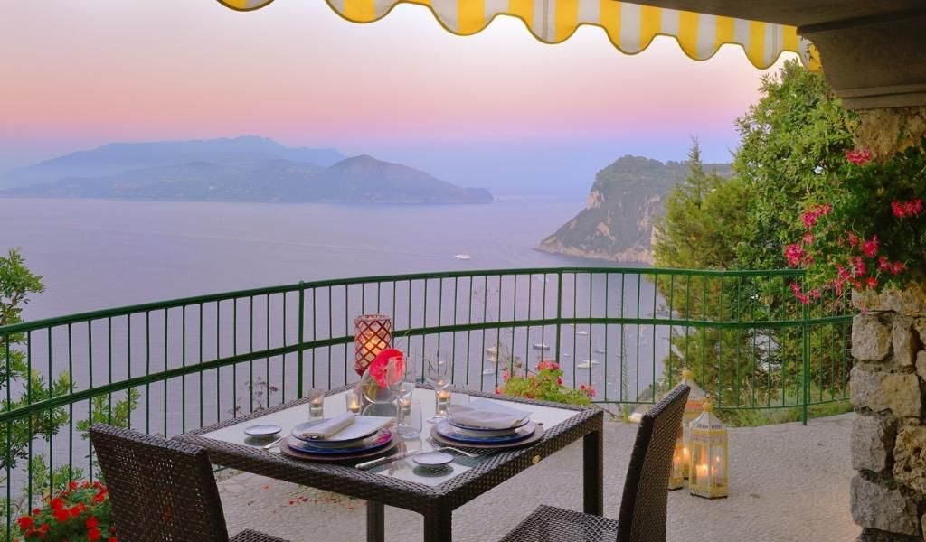 Dining on a terrace overlooking the deep blue waters of the Tyrrhenian Sea in La Terrezza di Lucullo.