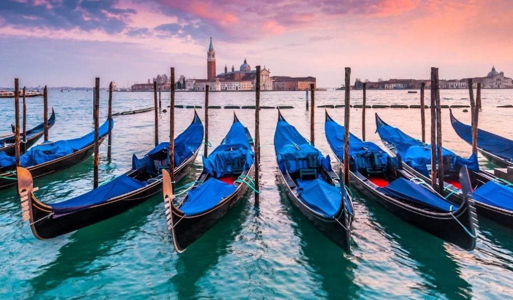 The Body of Ocean With Boats during Twilight in Venice, Italy.