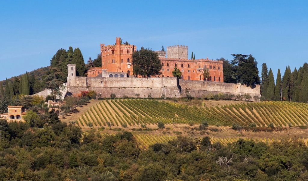 Stunning view of the Castello di Brolio with vineyards perfect for honeymoon stay